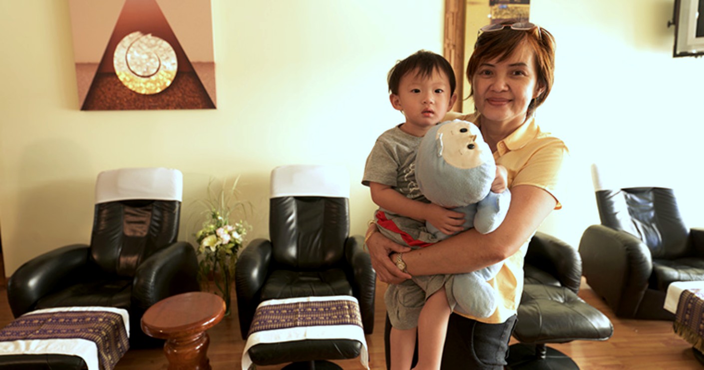 Khun Lek with family at the original Lek Massage location